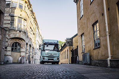 Electric Truck in an old city street.